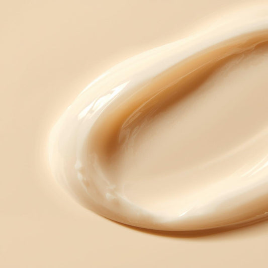 Close-up of Firming Lotion's thick, creamy texture with a smooth swirl — PureButterMelts