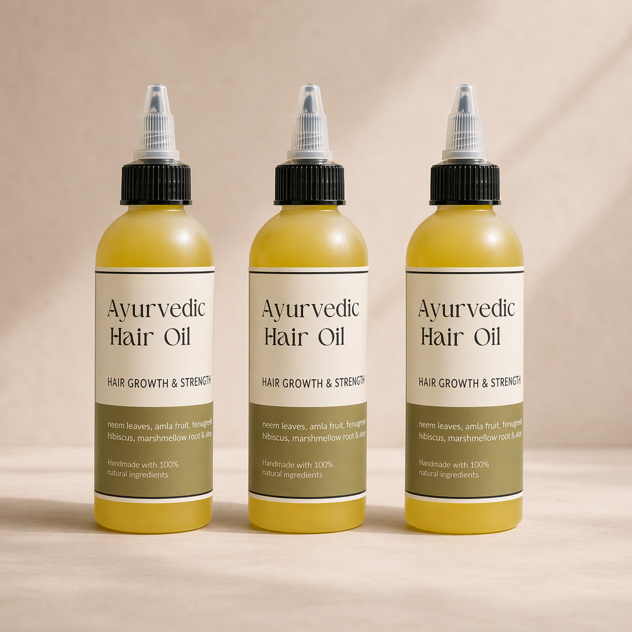 Three bottles of Ayurvedic Hair Oil on a beige background