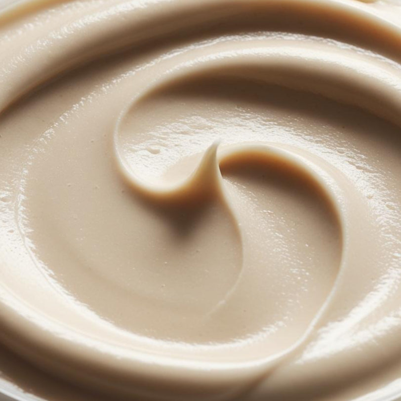 Close-up of Coffee Cream texture, light coffee-toned smooth swirl — PureButterMelts Bright Eyes Duo