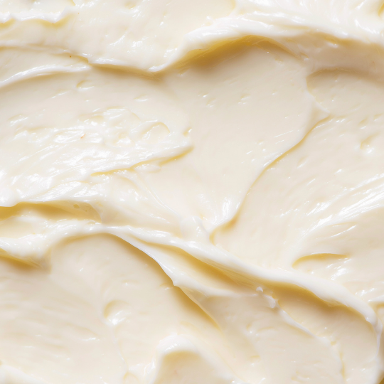 Close-up of whipped shea body butter showing smooth, emulsified consistency