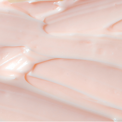 Close-up of smooth, creamy leave-in conditioner with soft peaks and a lightweight lotion texture.
