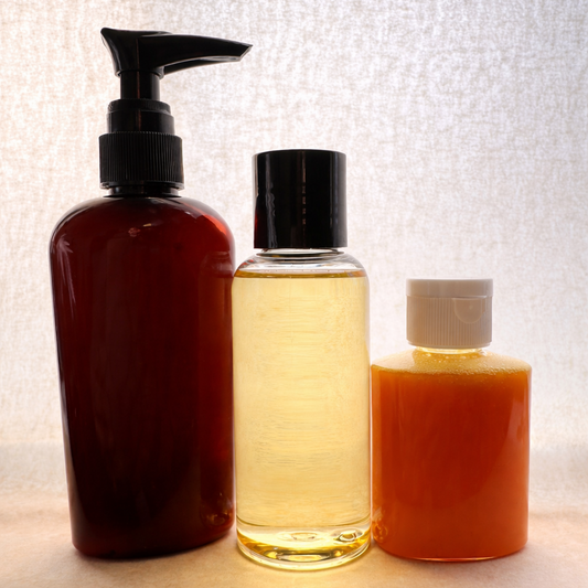 Three-piece Daily Care Kit with Sensitive Daily lotion, body oil, and turmeric facial cleanser on a neutral linen background.