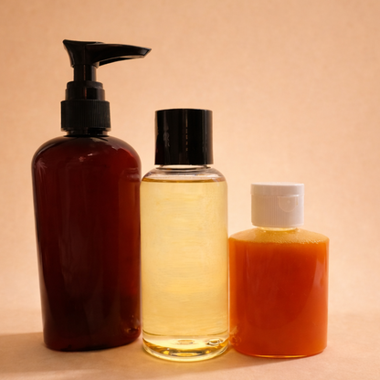 Three skincare bottles with different colored liquids on a beige background