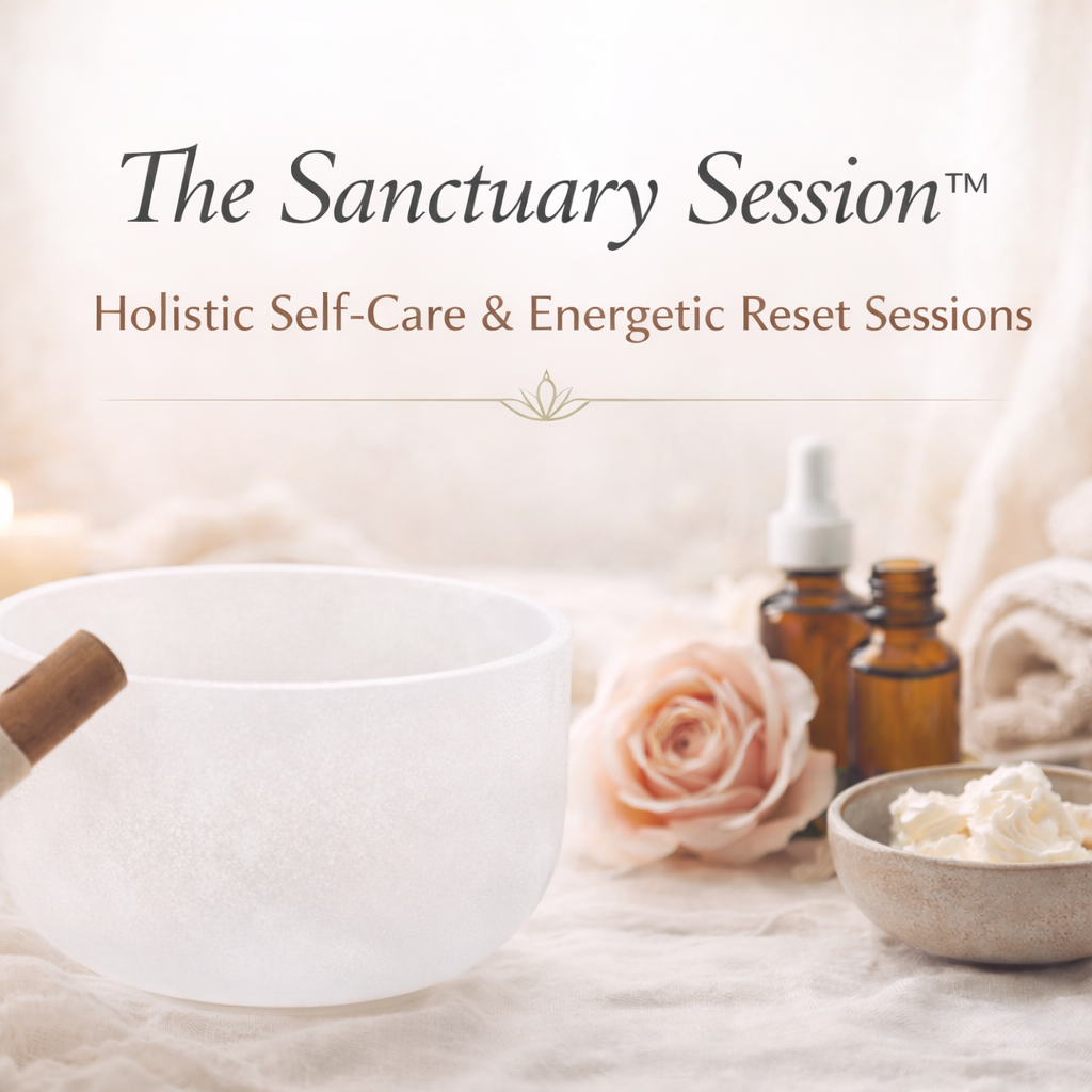 Frosted white crystal singing bowl with wooden mallet, amber wellness bottles, rose flower, folded towels, and body butter arranged on soft neutral fabric promoting The Sanctuary Session holistic self-care and energetic reset service.