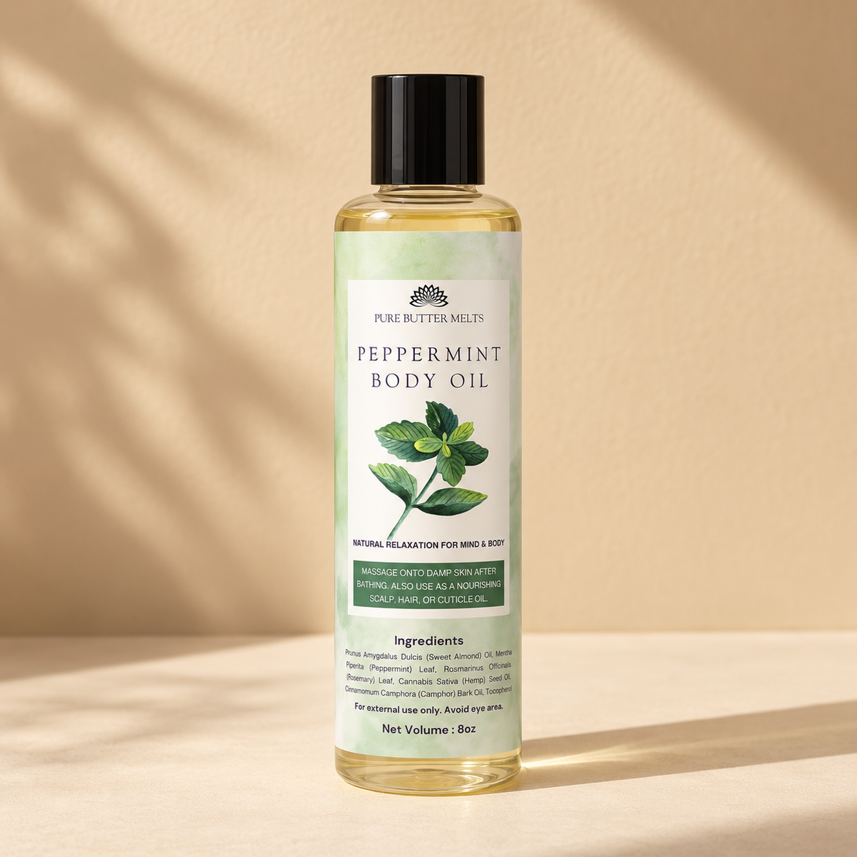 Pure Body Oil in Peppermint, an 8 oz clear glass bottle of botanical body oil — PureButterMelts