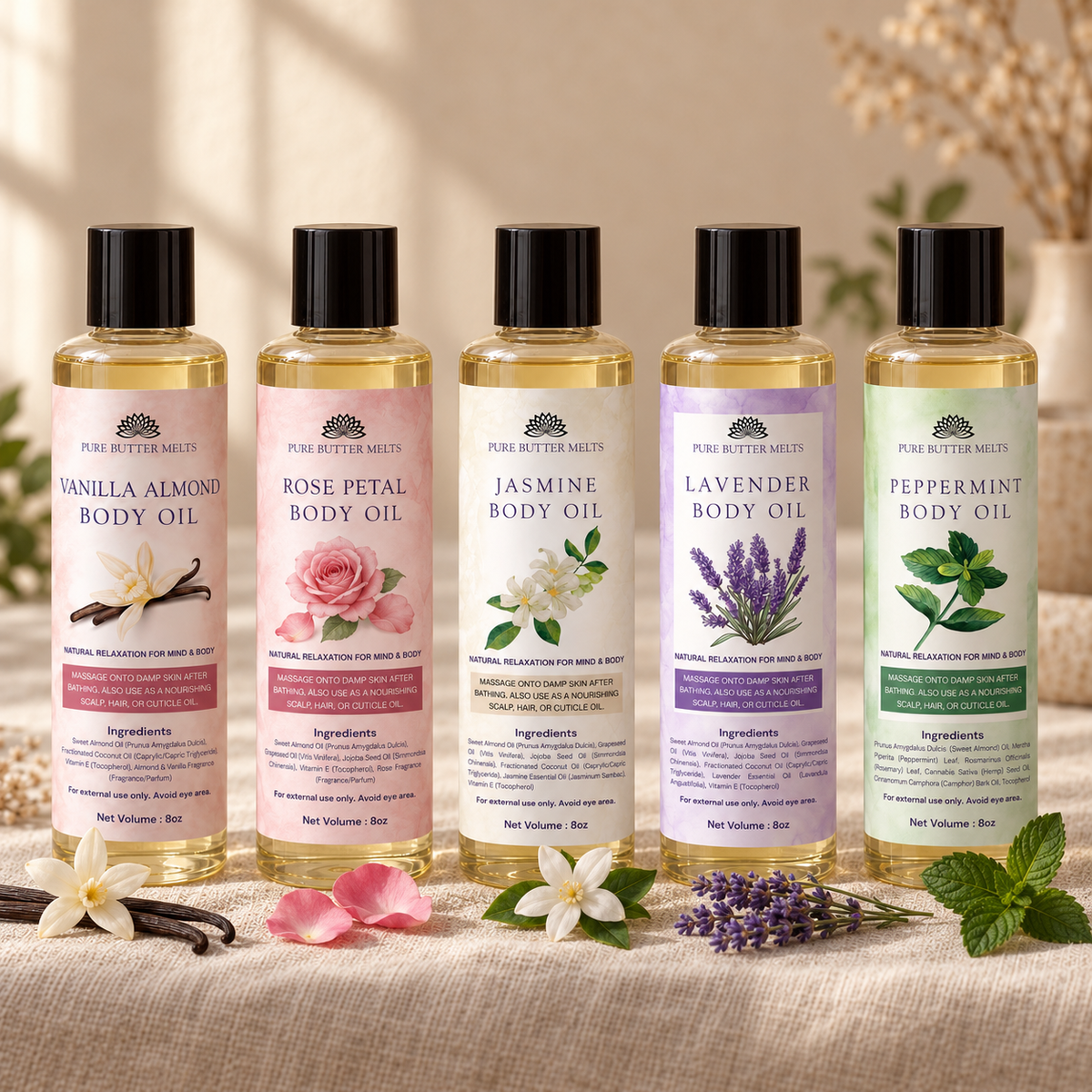All five Pure Body Oil blends lined up on textured beige linen with dried florals — Lavender, Vanilla Almond, Rose Petal, Jasmine and Peppermint — PureButterMelts